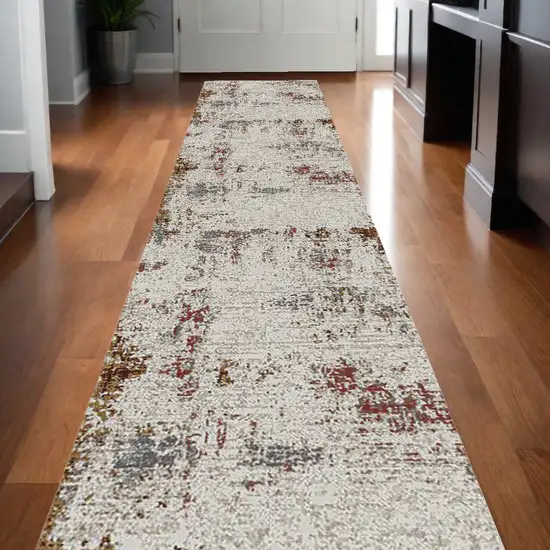 10' Red and Ivory Abstract Power Loom Runner Rug Photo 1