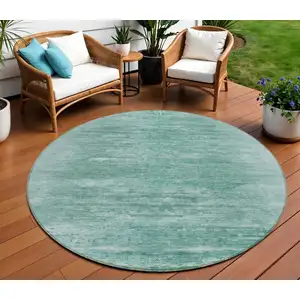 Photo of 8' Aqua And Teal Blue Round Abstract Washable Indoor Outdoor Area Rug