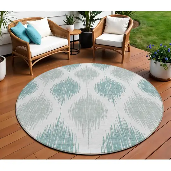 8' Aqua Teal Blue And Ivory Round Ikat Washable Indoor Outdoor Area Rug Photo 1