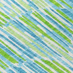 Photo of 8' Aqua Teal Blue And Lime Green Round Abstract Washable Indoor Outdoor Area Rug