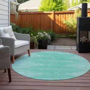 Photo of 8' Aquamarine And Ivory Round Abstract Washable Indoor Outdoor Area Rug