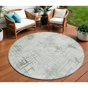 Photo of 8' Artichoke Green And Ivory Round Geometric Washable Indoor Outdoor Area Rug