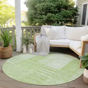 Photo of 8' Artichoke Green And Mint Green Round Striped Washable Indoor Outdoor Area Rug