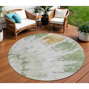 Photo of 8' Artichoke Green And Olive Green Round Abstract Washable Indoor Outdoor Area Rug