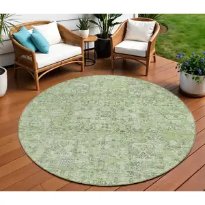 Photo of 8' Artichoke Green And Olive Green Round Floral Washable Indoor Outdoor Area Rug