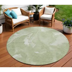 Photo of 8' Artichoke Green Fern Green And Ivory Round Abstract Washable Indoor Outdoor Area Rug