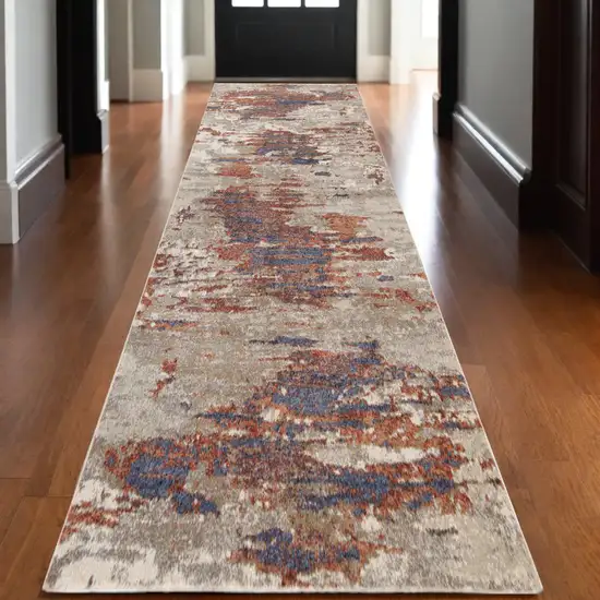 10' Beige Rust and Blue Abstract Power Loom Runner Rug Photo 1