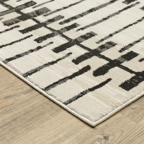 8' Beige And Black Geometric Runner Rug Photo 8