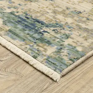 Photo of 12' Beige And Blue Abstract Runner Rug With Fringe