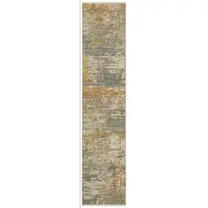 Photo of 12' Beige And Gold Abstract Runner Rug With Fringe