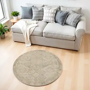 Photo of 4' Beige And Gray Oriental Distressed Round Rug