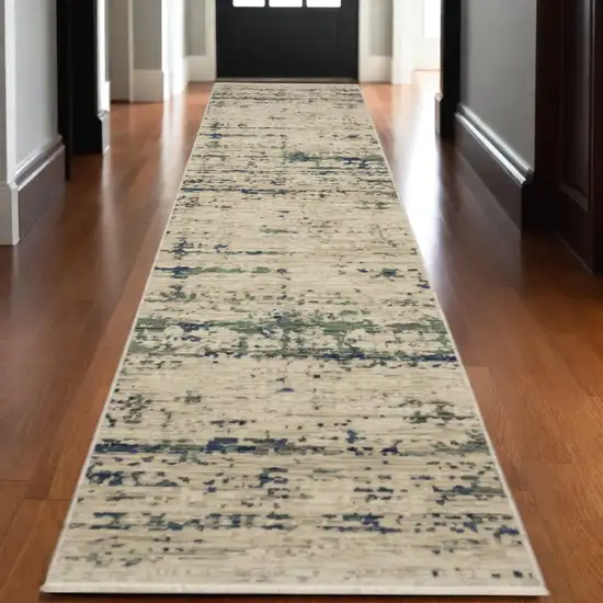 12' Beige And Green Abstract Runner Rug With Fringe Photo 1