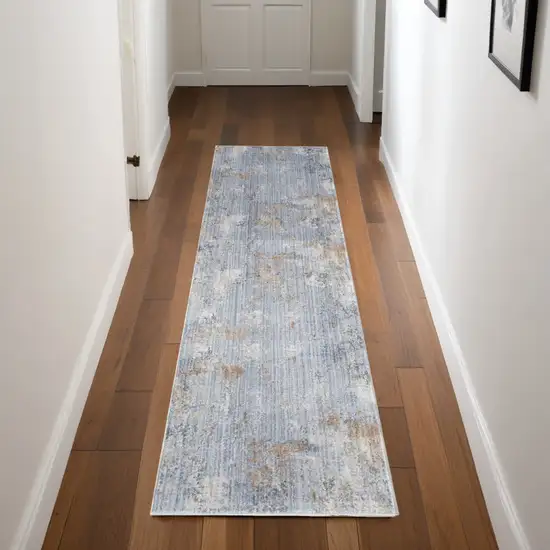 8' Beige Blue and Gray Abstract Runner Rug With Fringe Photo 1