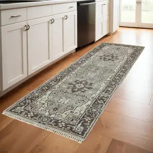 Photo of 8' Beige Blue and Gray Medallion Hand Knotted Runner Rug With Fringe