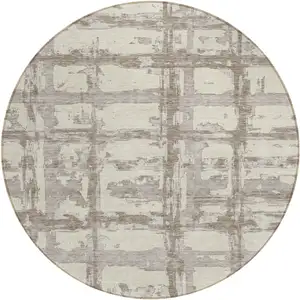 Photo of 8' Beige Brown And Taupe Round Striped Washable Indoor Outdoor Area Rug