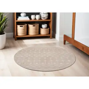 Photo of 5' Beige Geometric Power Loom Round Rug