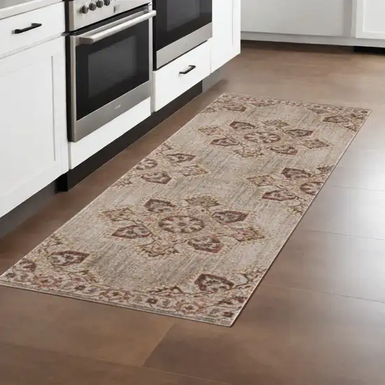 7' Beige and Rust Medallion Power Loom Runner Rug Photo 1