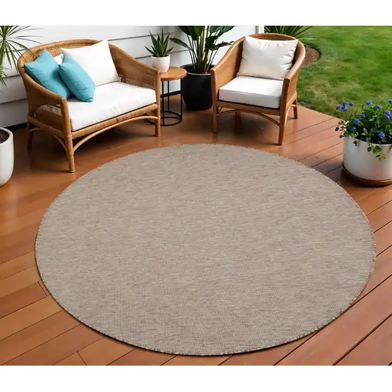 8' Beige Round Power Loom Area Rug Photo 1