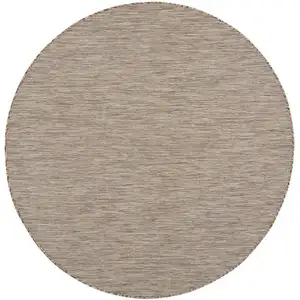 Photo of 6' Beige Round Power Loom Area Rug