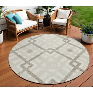 Photo of 8' Beige Tan And Ivory Round Geometric Washable Indoor Outdoor Area Rug