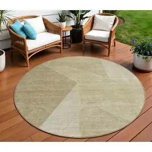 Photo of 8' Beige Tan And Ivory Round Geometric Washable Indoor Outdoor Area Rug