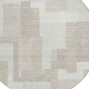 Photo of 8' Beige Tan And Taupe Round Abstract Washable Indoor Outdoor Area Rug