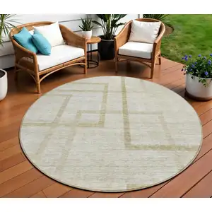 Photo of 8' Beige Tan And Taupe Round Geometric Washable Indoor Outdoor Area Rug