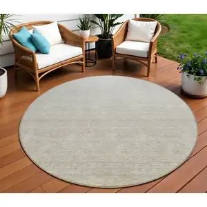 Photo of 8' Beige Tan And Taupe Round Ombre Washable Indoor Outdoor Area Rug