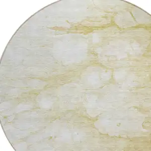 Photo of 8' Beige Taupe And Artichoke Green Round Abstract Washable Indoor Outdoor Area Rug