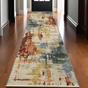 Photo of 12' Beige Yellow And Salmon Abstract Runner Rug With Fringe