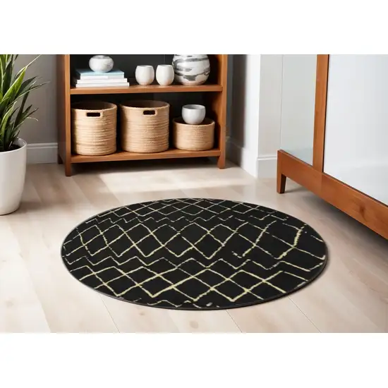 5' Beige and Black Round Abstract Power Loom Area Rug Photo 1