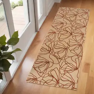 Photo of 6' Beige and Bronze Floral Washable Area Rug With UV Protection