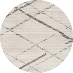 Photo of 5' Beige and Gray Abstract Distressed Round Rug