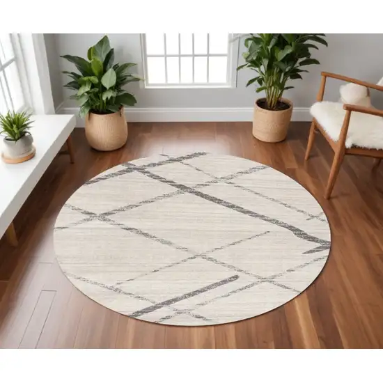 8' Beige and Gray Abstract Distressed Round Rug Photo 1