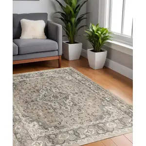 Photo of 4' Beige and Gray Square Medallion Power Loom Distressed Area Rug