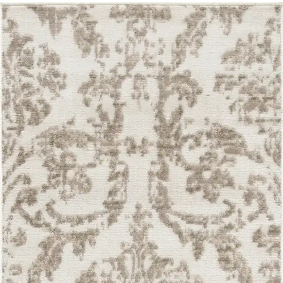 7' Beige and Ivory Damask Distressed Runner Rug Photo 7