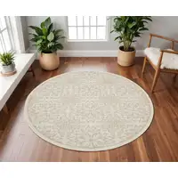 Photo of 8' Beige and Ivory Floral Non Skid Round Rug