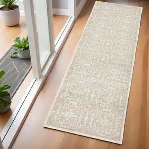 Photo of 6' Beige and Ivory Floral Non Skid Runner Rug