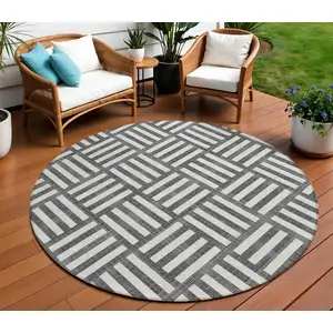 Photo of 8' Black And Ivory Round Geometric Washable Indoor Outdoor Area Rug