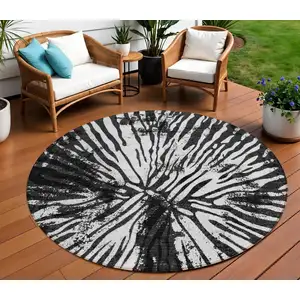 Photo of 8' Black Charcoal And Ivory Round Abstract Washable Indoor Outdoor Area Rug