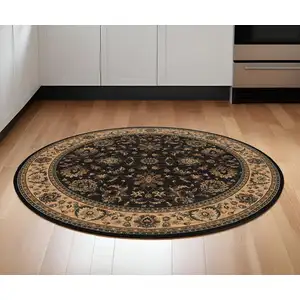 Photo of 6' Black Ivory and Brown Oriental Round Rug