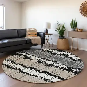 Photo of 8' Black Silver And Gray Round Striped Washable Indoor Outdoor Area Rug