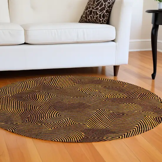 8' Black and Gold Round Abstract Non Skid Area Rug Photo 1