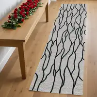 Photo of 8' Black and Taupe Abstract Hand Tufted Runner Rug