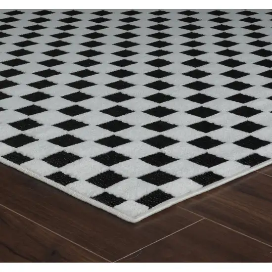 10' Black and White Geometric Distressed Indoor Outdoor Runner Rug Photo 6