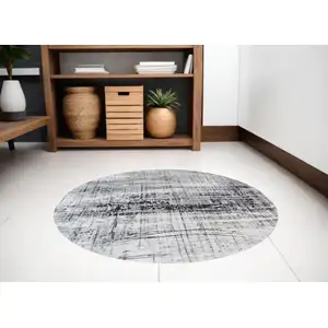 Photo of 5' Black and White Round Abstract Non Skid Area Rug