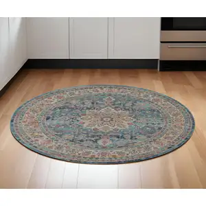 Photo of 6' Blue And Beige Floral Distressed Round Rug