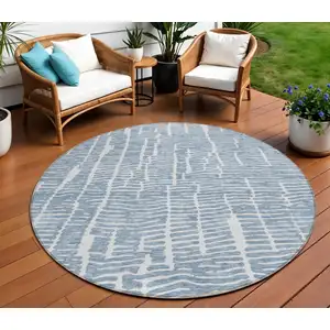 Photo of 8' Blue And Ivory Round Abstract Washable Indoor Outdoor Area Rug