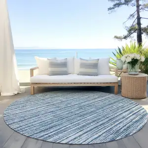 Photo of 8' Blue And Ivory Round Striped Washable Indoor Outdoor Area Rug