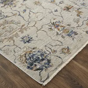 Photo of 10' Blue Gray and Brown Floral Power Loom Worn Faded Runner Rug With Fringe